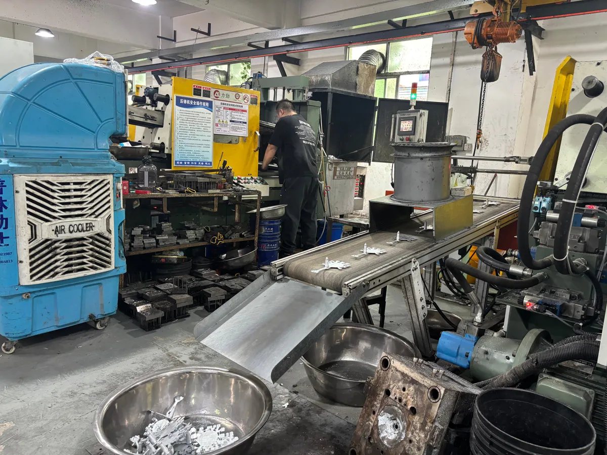 Metal dice die casting workshop with production machinery and cast components