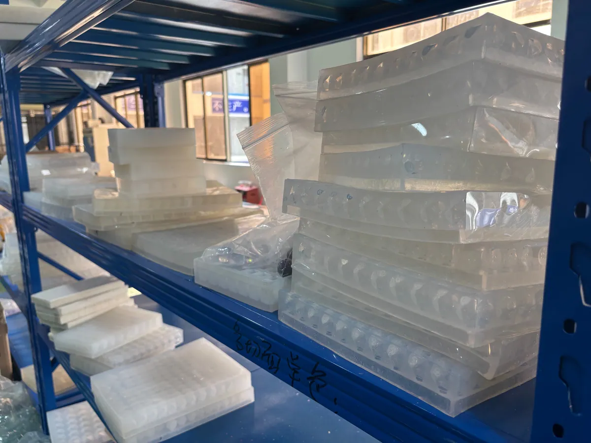 Rows of silicone molds prepared for resin polyhedral dice casting